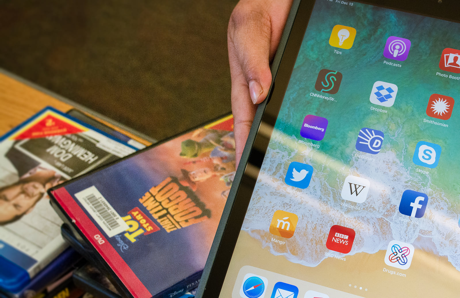 Photo of an iPad on top of DVDs