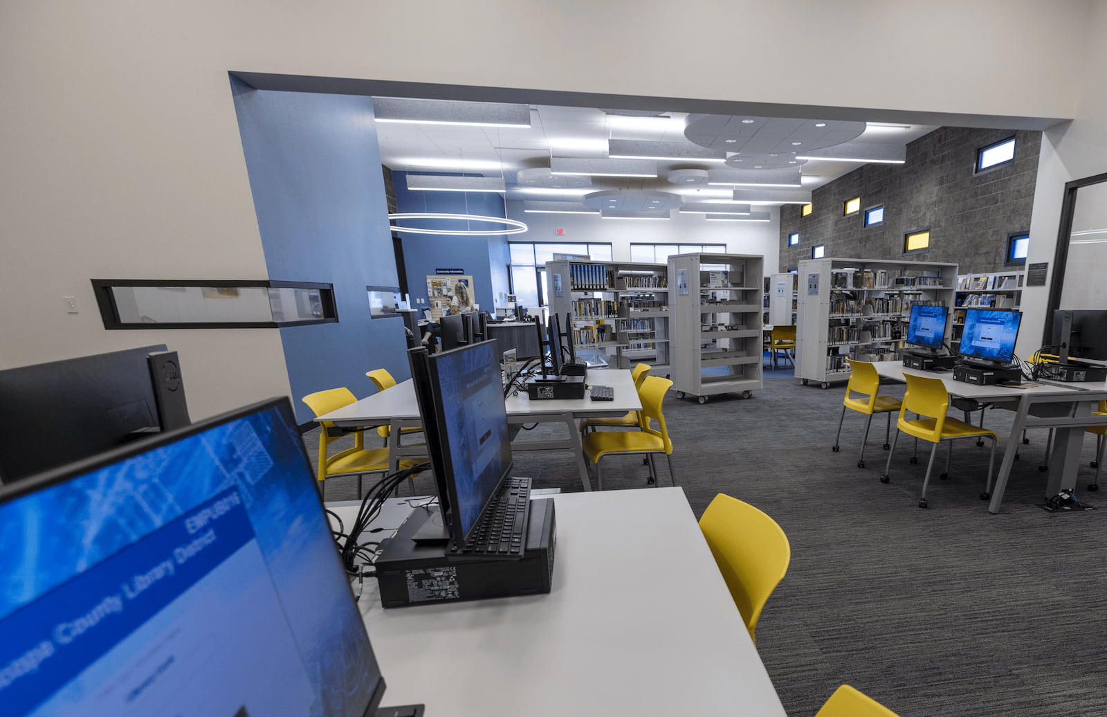 Photo of the computer area with bookshelves in the background