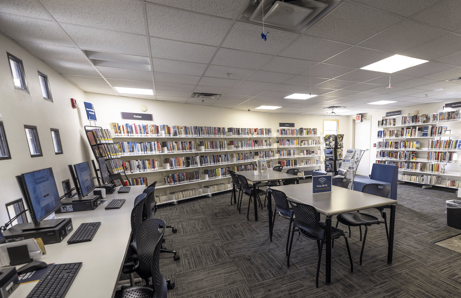 Photo of the adult computers, tables and bookshelves